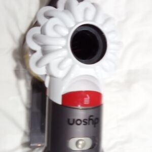 Dyson Vacuum Cleaner with White and Red Accents